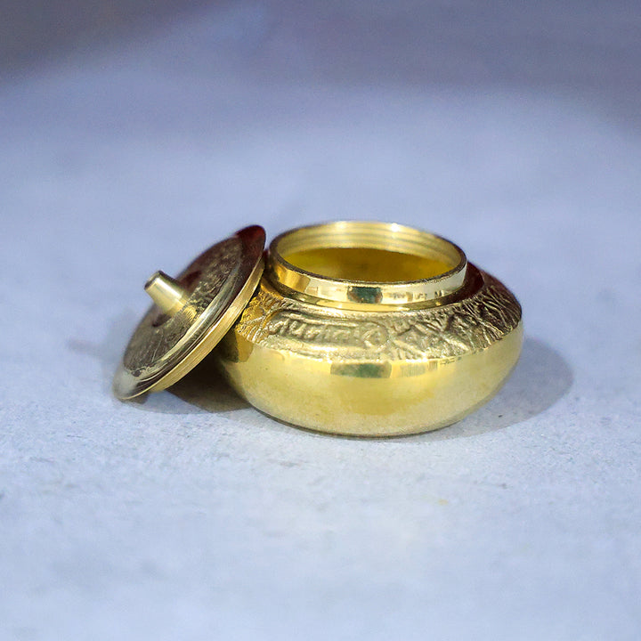 Brass Kumkum Dabbi Embossed Mila – A Sacred Container for Devotional Offerings