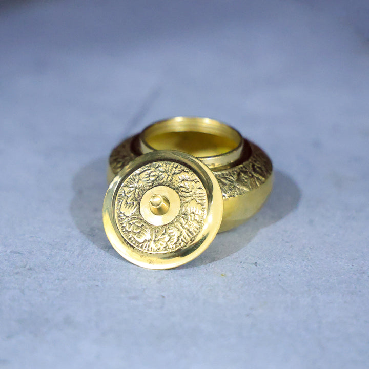 Brass Kumkum Dabbi Embossed Mila – A Sacred Container for Devotional Offerings