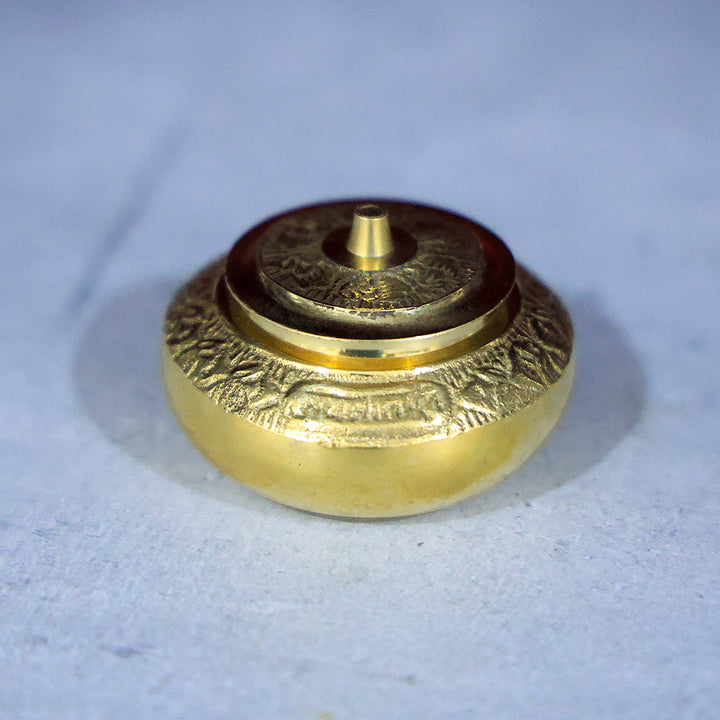 Brass Kumkum Dabbi Embossed Mila – A Sacred Container for Devotional Offerings